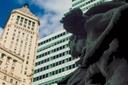 Just north from Battery Park, huge statues flank the steps to Lower Manhattans landmark U.S. Customs House.